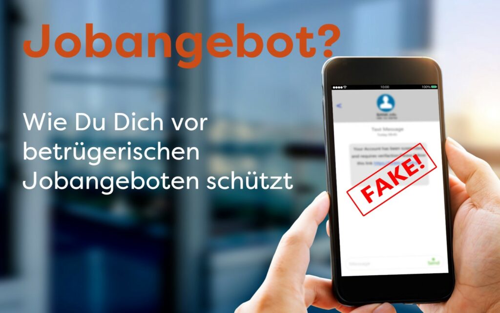 Hand hält Handy, auf Handy steht FAKE